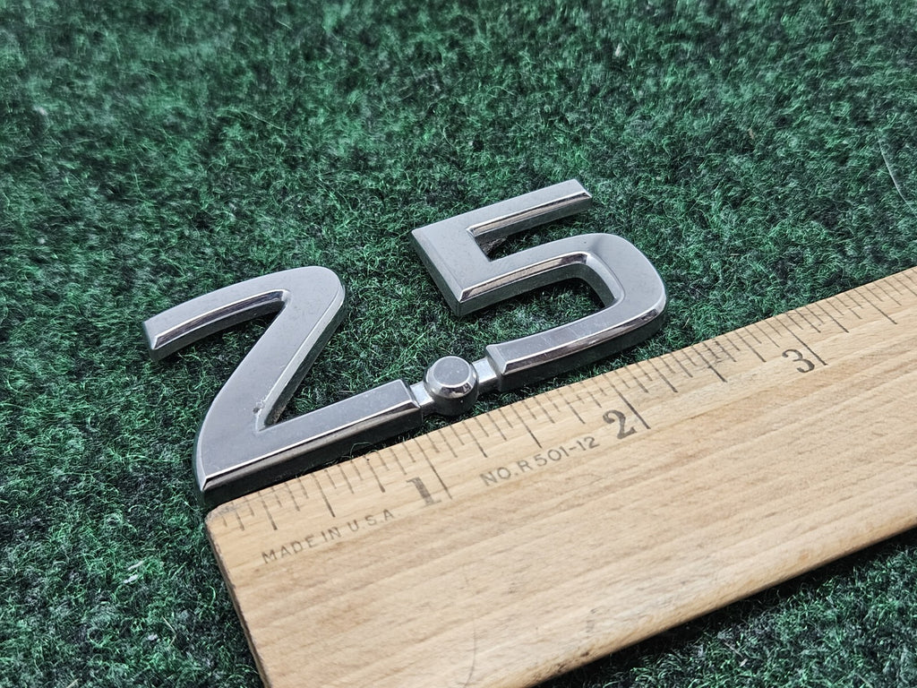 NISSAN 2.5 REAR CHROME EMBLEM LOGO SYMBOL BADGE OEM 7S8