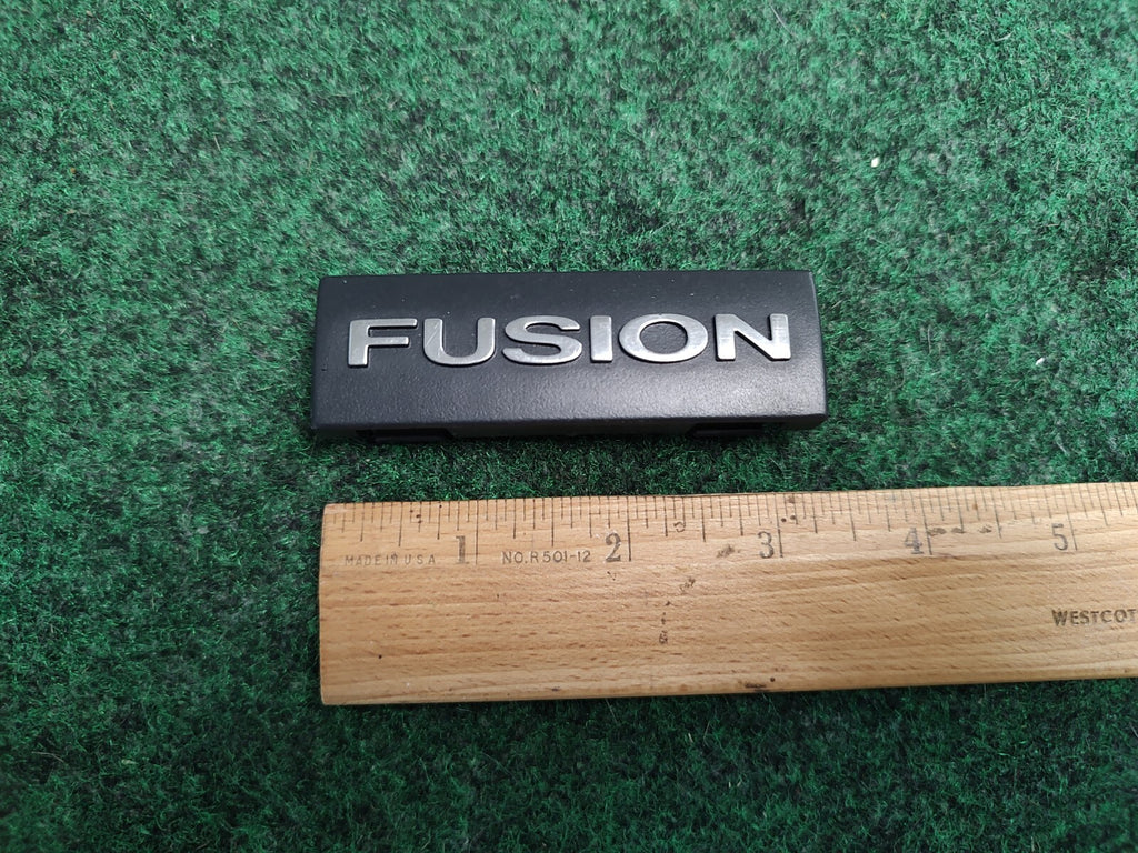 2006-2009 FORD FUSION DASH EMBLEM LOGO BADGE SYMBOL USED OEM 1S4