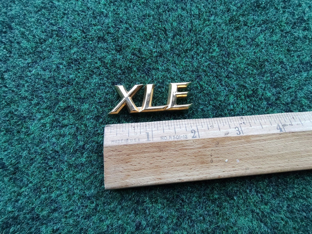 TOYOTA CAMRY XLE REAR GOLD EMBLEM LOGO BADGE SYMBOL NAME PLATE OEM  5S4