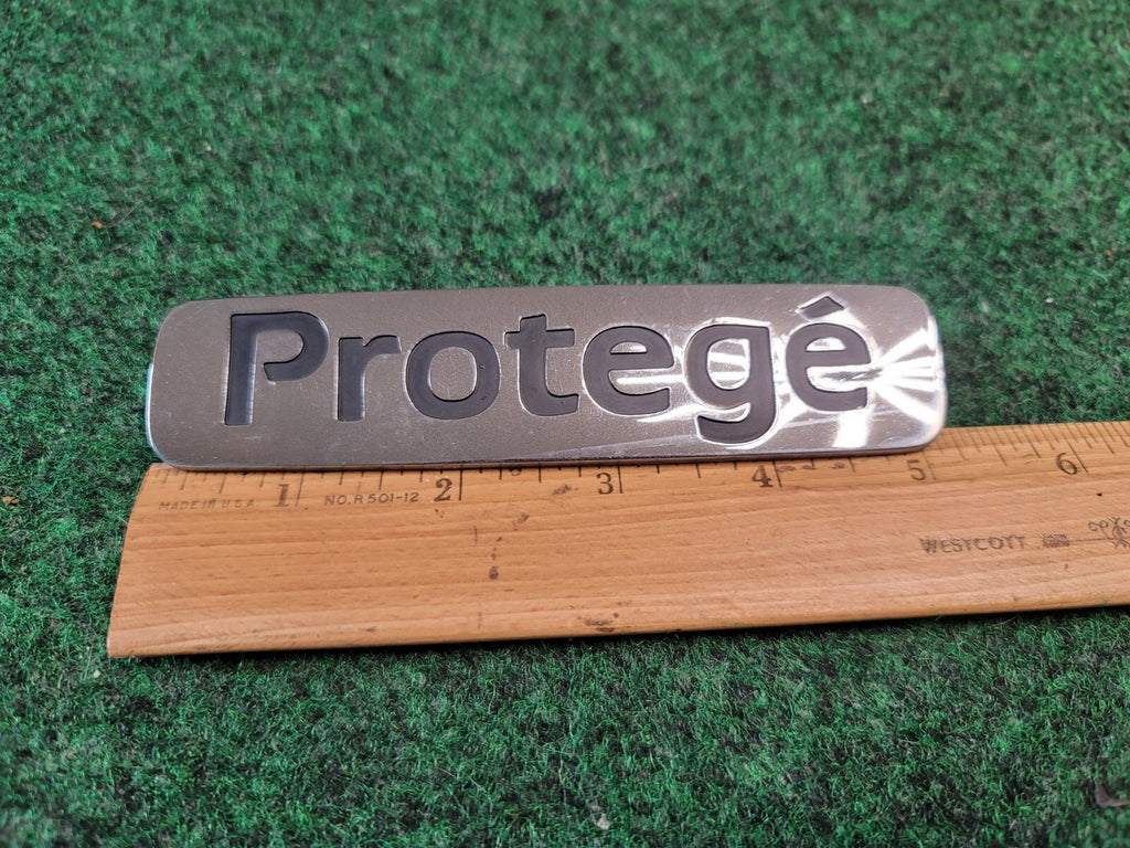 1999-2001 Mazda Protege Emblem Rear Lid Trunk Badge Logo Symbol Chrome OEM 2M4
