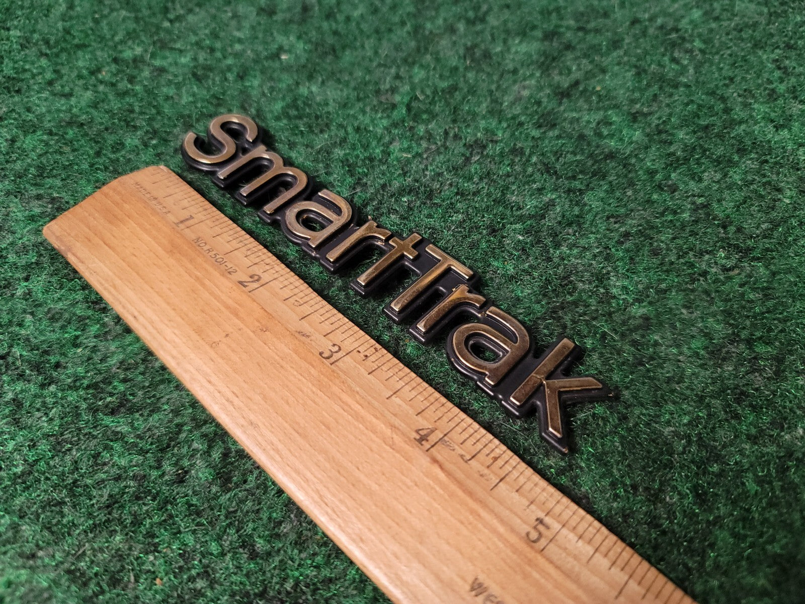 1997-2001 Oldsmobile Bravada "SmartTrak" Hatch/Trunk Emblem - P/N - 15957899 5S8