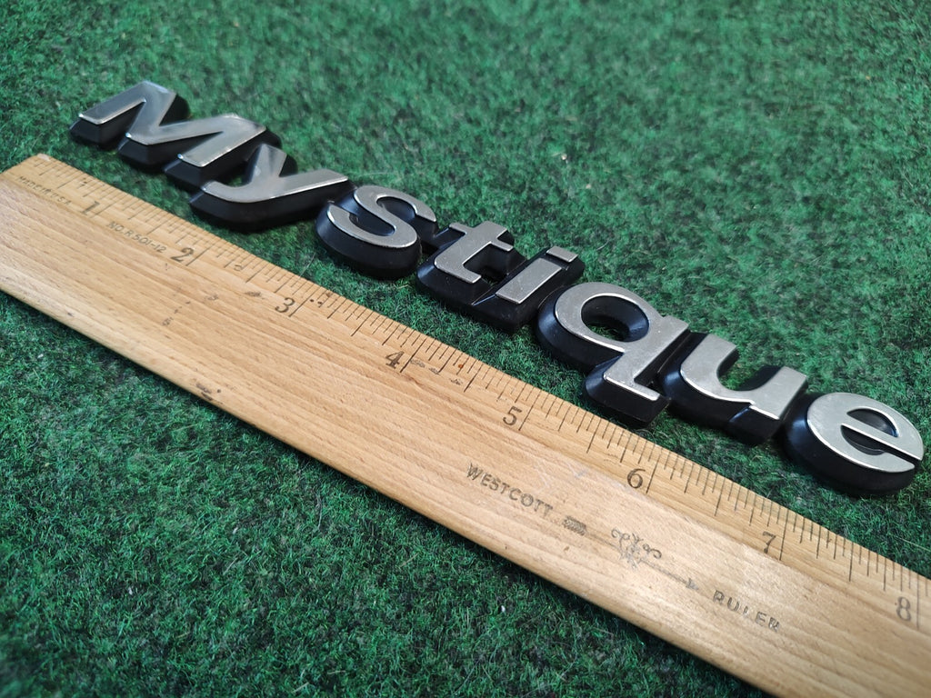 95 96 97 98 99 00 MERCURY MYSTIQUE REAR EMBLEM LOGO BADGE SIGN SYMBOL OEM 2S8