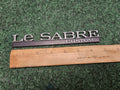 BUICK LESABRE CUSTOM - OEM EMBLEM BADGE SYMBOL LOGO NAME PLATE 6M9