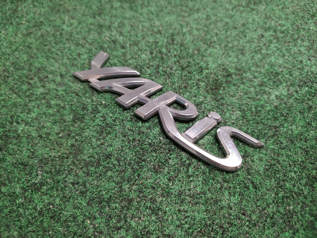 2006-2011 TOYOTA YARIS REAR EMBLEM LOGO BADGE SYMBOL CHROME LETTERS OEM 1S2