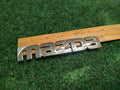 2002-2003 Mazda Protege 5 Rear Emblem Ornament Maker Name B25R-51-710 OEM 3S8