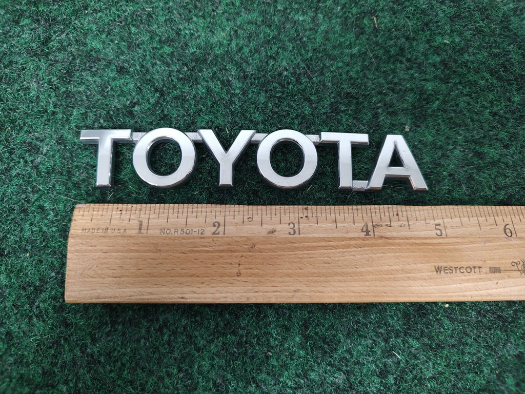 Toyota OEM Chrome Plastic 5" Rear Trunk Emblem Badge Logo Nameplate Name 1M4