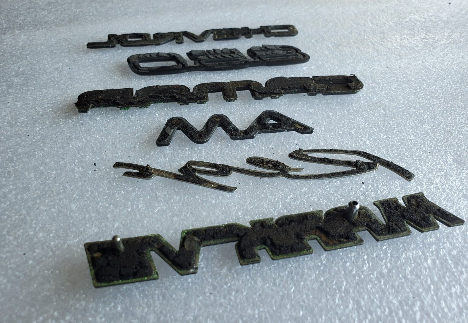 Misc Lot Of Emblwms Vintage Letters Logo OEM Mark VIII VOLVO Regal Camaro VNTG