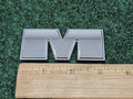 Dodge OEM 2009-2018 Ram "M" Letter Emblem Badge Logo Nameplate 7S7
