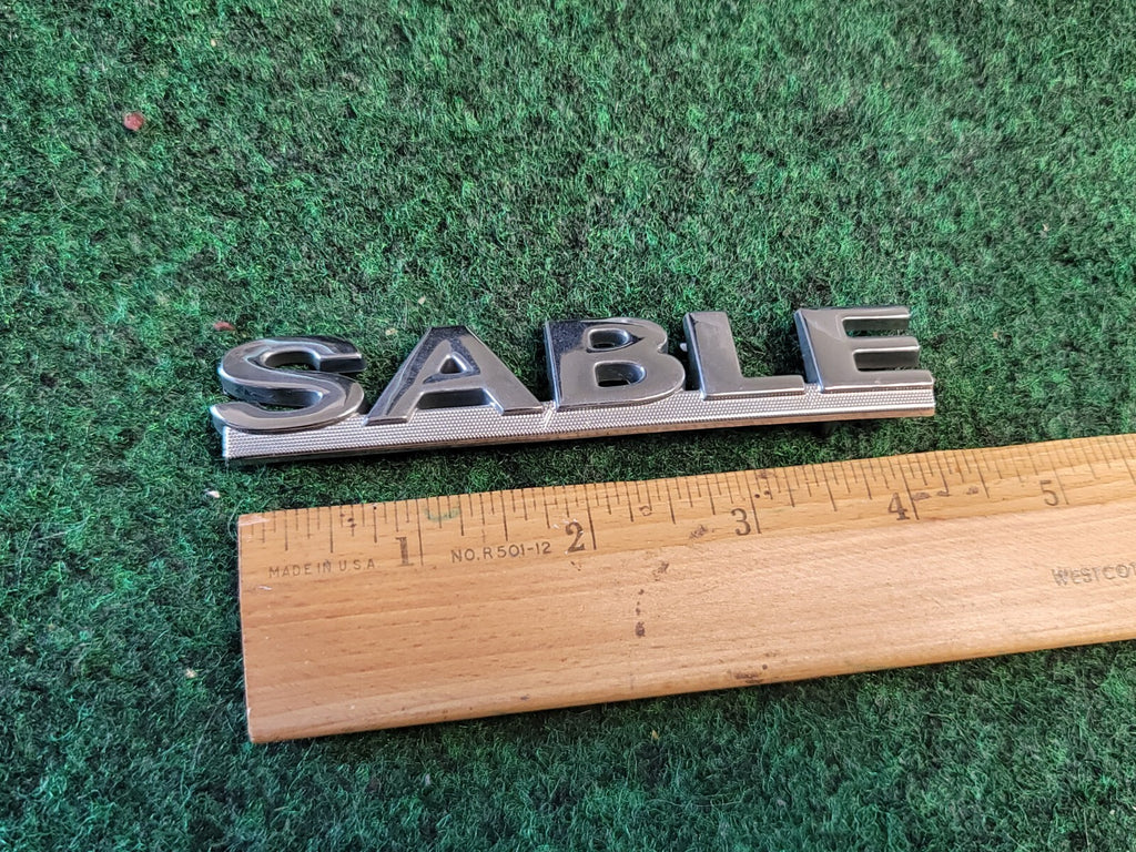 00 01 02 03 MERCURY SABLE REAR GATE LID EMBLEM BADGE SYMBOL LOGO OEM 1M6