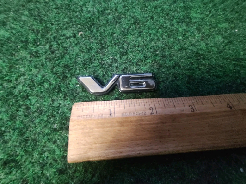 Pontiac OEM V6 Gold Black Plastic Emblem Badge Logo Nameplate Name Plate 4S3