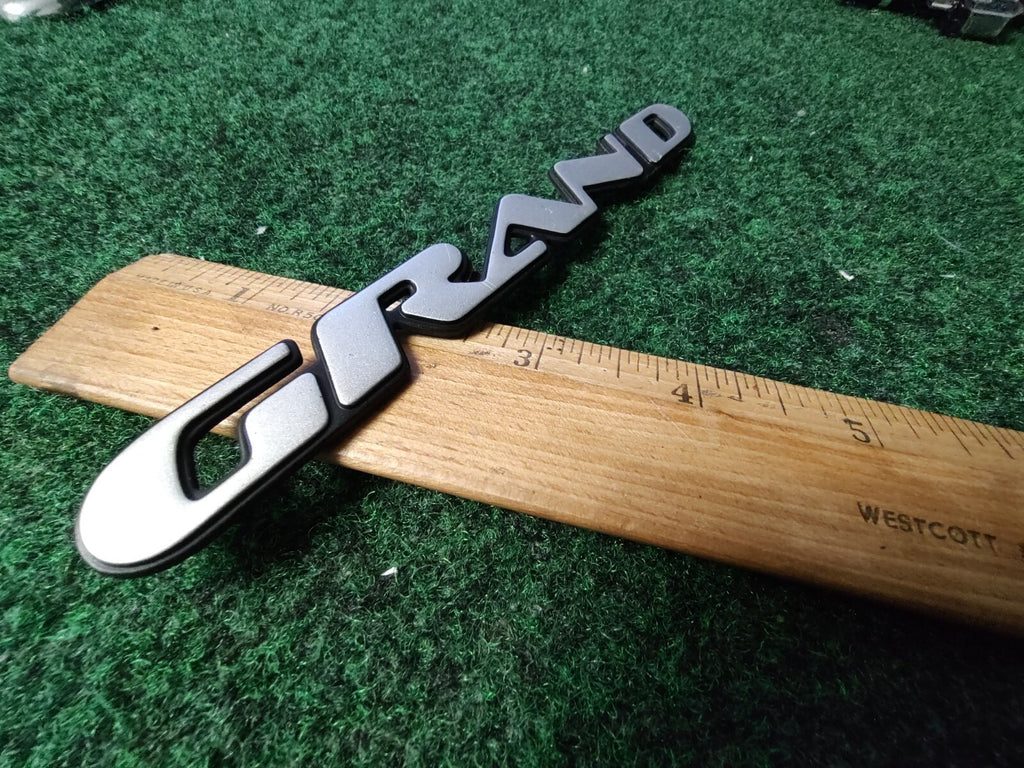 1997 - 2003 Pontiac " Grand " Prix Door Name Plate Silver NAMEPLATE OEM 3S6