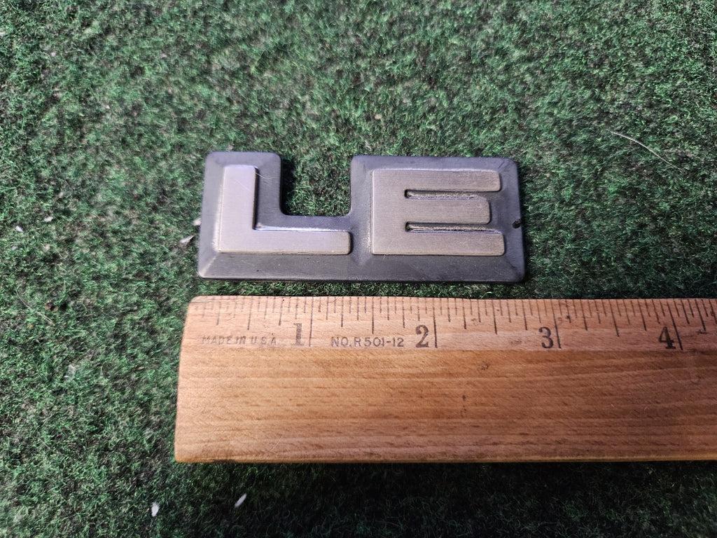 1987-1996 Dodge Dakota LE Cab Corner Emblem Name Plate Badge  55026887 5L9