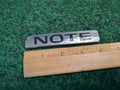 2014 -2019 Nissan Versa Note Liftgate Trunk Back Door Emblem 90892-3VY2A OEM 5S1