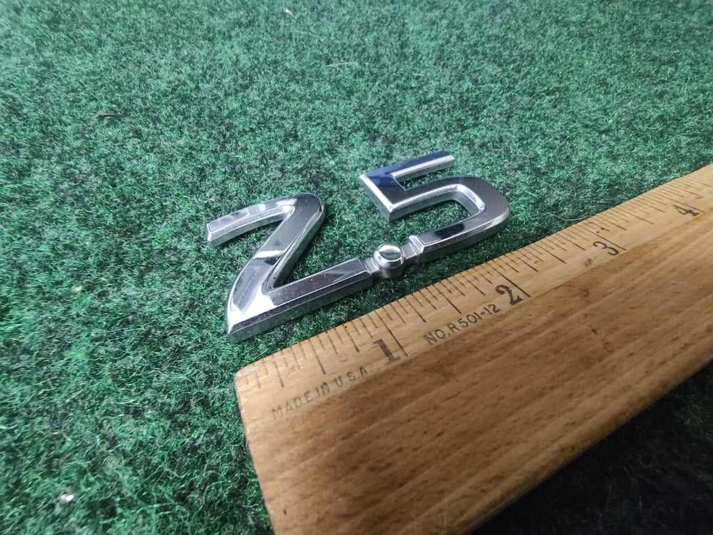 NISSAN 2.5 REAR CHROME EMBLEM LOGO SYMBOL BADGE OEM 8L3