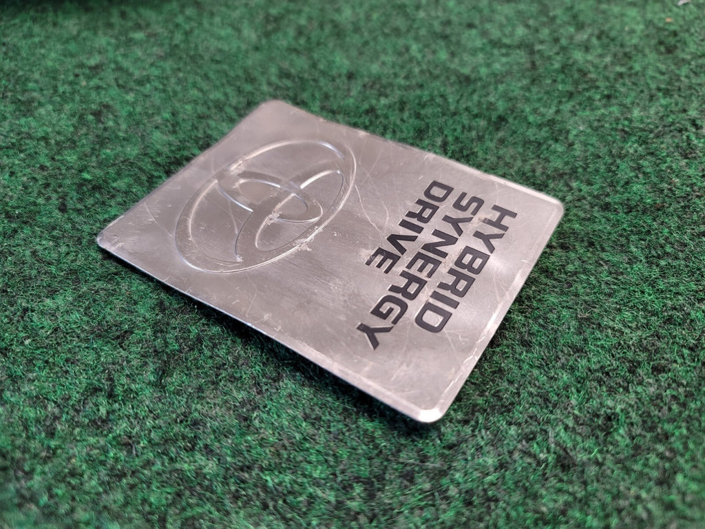 2004-2009 TOYOTA PRIUS HYBRID SYNERGY DRIVE DC CONVERTER EMBLEM BADGE OEM 2M3