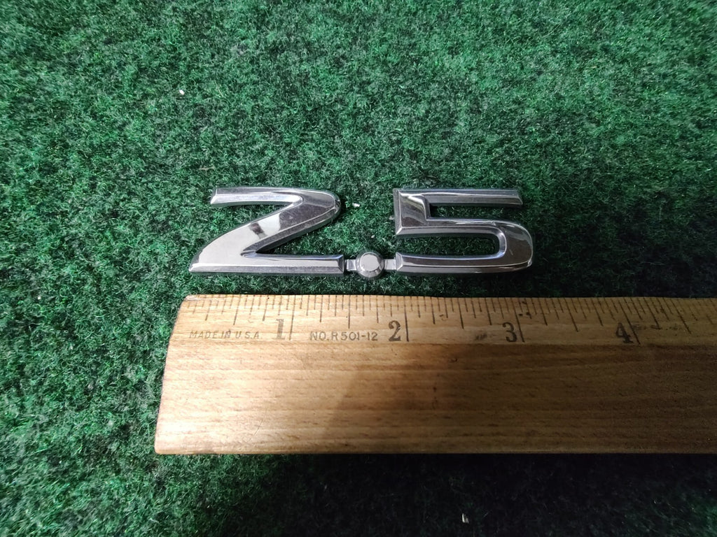 NISSAN 2.5 REAR CHROME EMBLEM LOGO SYMBOL BADGE OEM 7S1