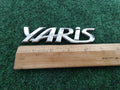 2006-2011 TOYOTA YARIS REAR EMBLEM LOGO BADGE SYMBOL CHROME LETTERS OEM 5S5