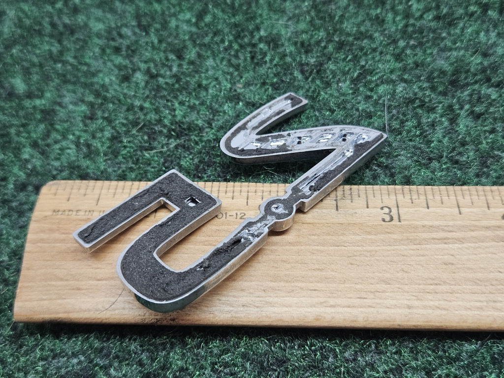 NISSAN 2.5 REAR CHROME EMBLEM LOGO SYMBOL BADGE OEM 7S7