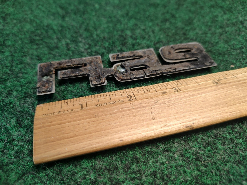 1984-1989 CHEVY CELEBRITY 2.5 FI REAR SIDE EMBLEM BADGE SYMBOL LOGO OEM 4S9