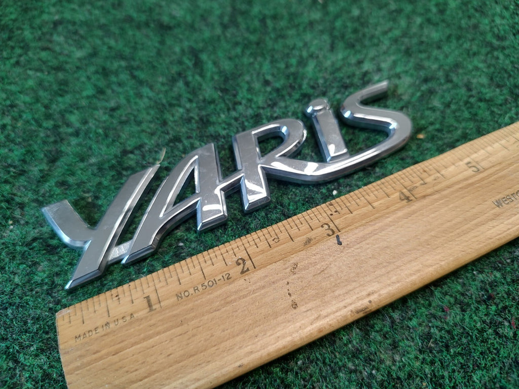 2006-2011 TOYOTA YARIS REAR EMBLEM LOGO BADGE SYMBOL CHROME LETTERS OEM 3S7