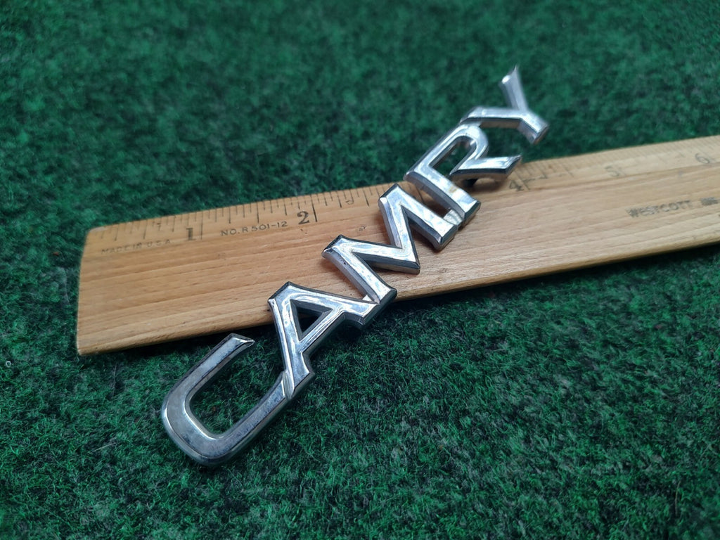 Toyota Camry Emblem Badge Name Plate Logo Chrome OEM Genuine 8L2