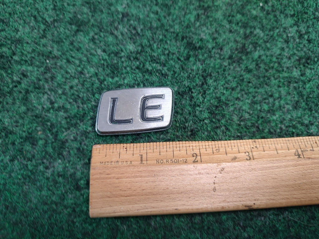 1997 - 2001 Toyota Camry Luggage Compartment Emblem LE Lettering 3S7