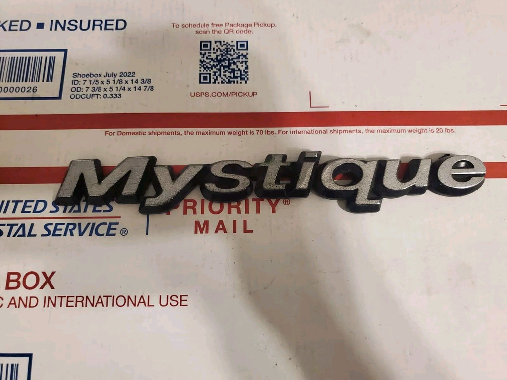 95 96 97 98 99 00 MERCURY MYSTIQUE REAR EMBLEM LOGO BADGE SIGN SYMBOL OEM 4L9